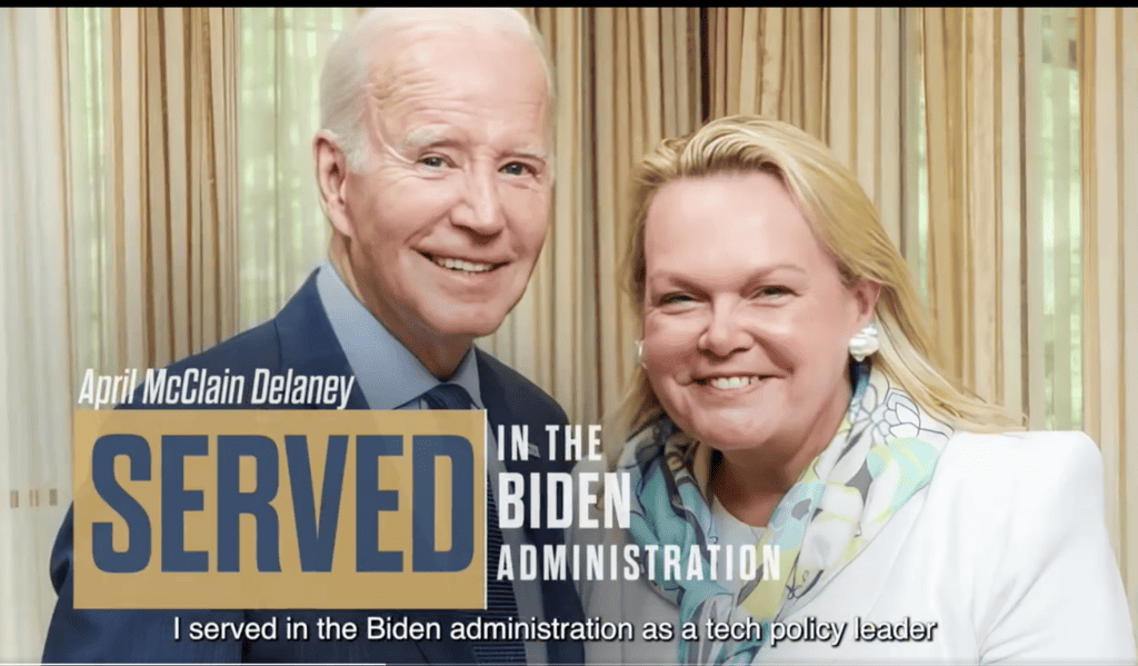 This image is a screenshot from April McClain Delaney's first television ad, where she emphasized her professional experience working in Joseph R. Biden Jr.'s presidential administration. 